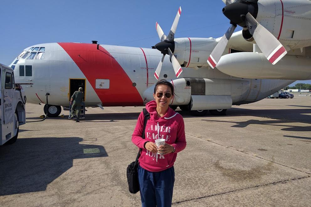 photo of someone standing in front of planes